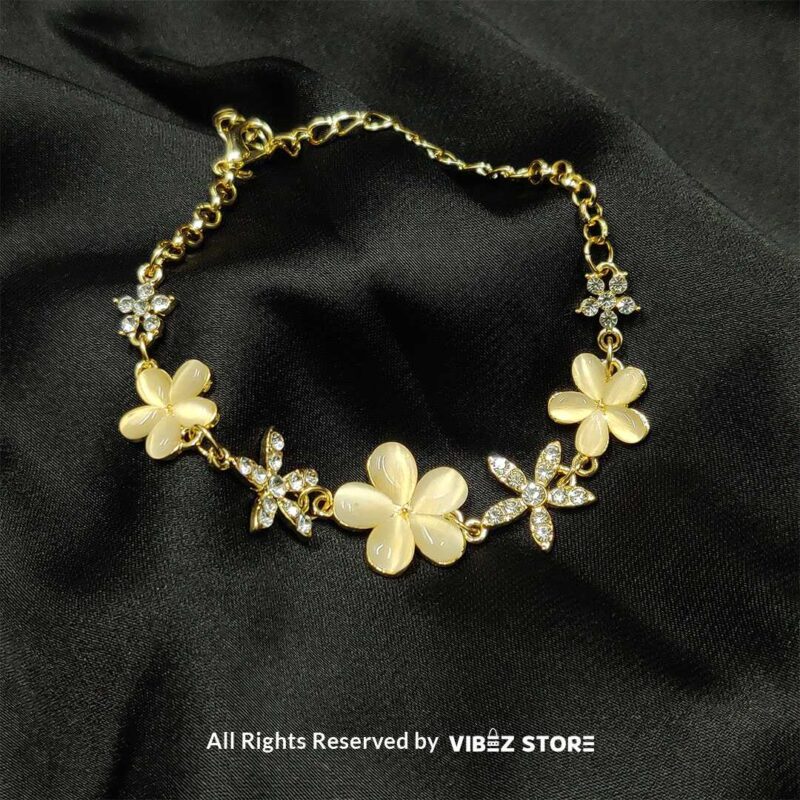 Ivory Floral Charm Bracelet with delicate crystals set on a golden chain from VibezStore