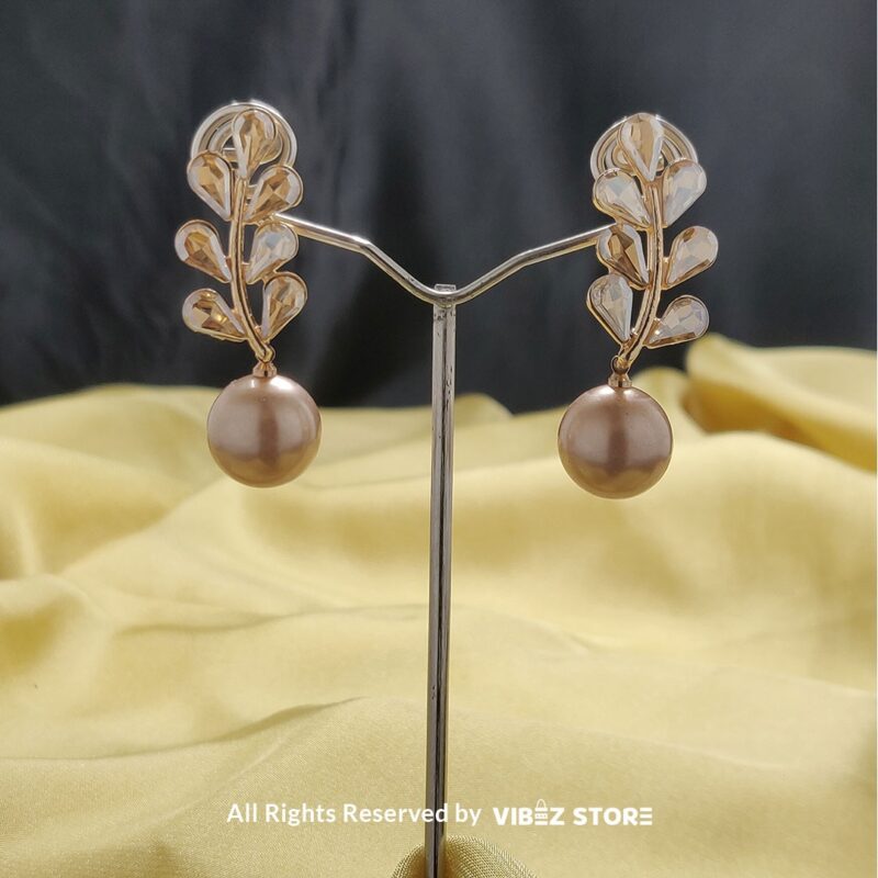 Leaf Pearl Drop Earrings with gold-tone settings, delicate leaf design, and smooth pearl drops from VibezStore