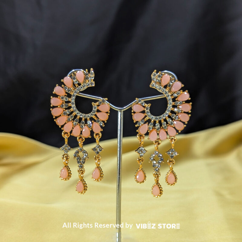 Teardrop dangle earrings in crescent design with crystal details, shown in pink and black color variations by Vibez Store.