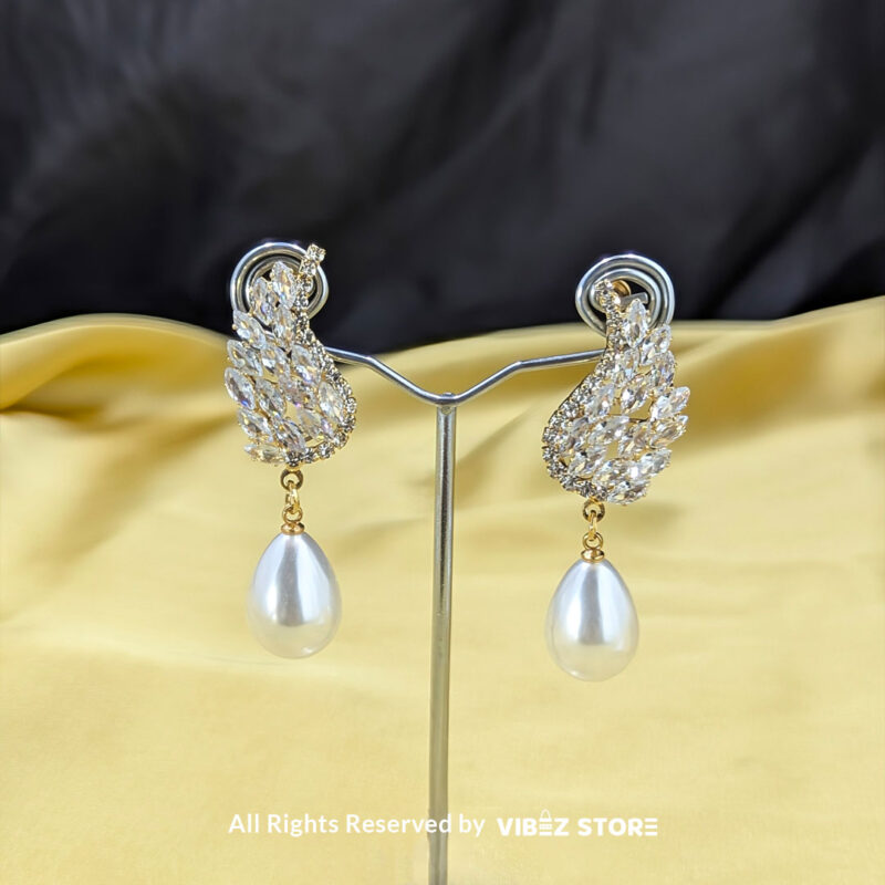 Crystal wing earrings with a pearl drop, designed elegantly for formal occasions, displayed by Vibez Store.