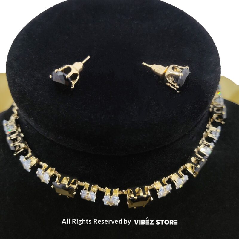 Square-stone choker necklace with matching earrings on display, featuring alternating black and clear stones