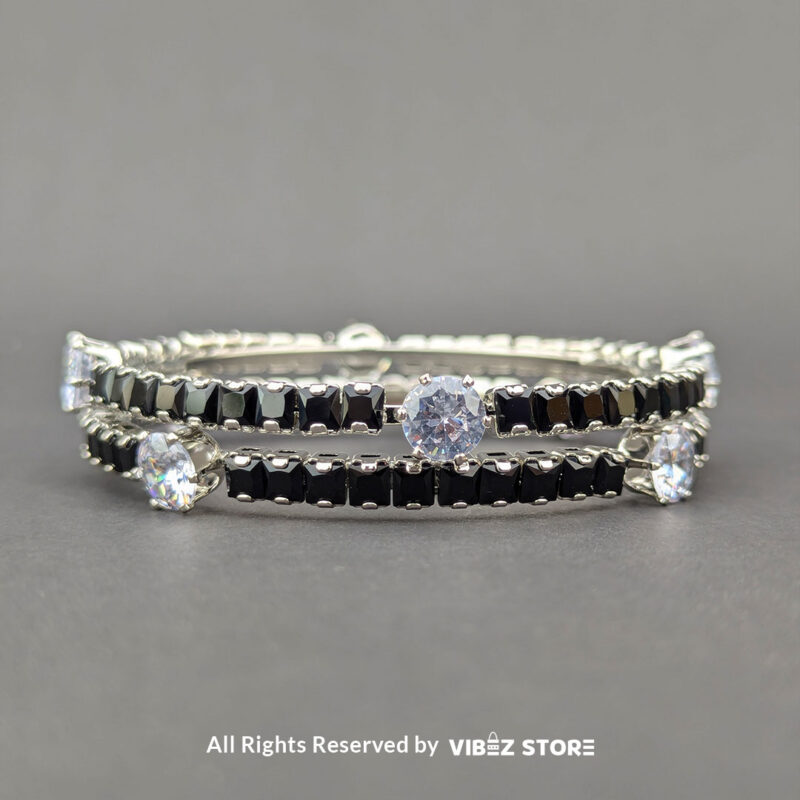 Elegant silver bangles with black square crystals and sparkling round stones.

