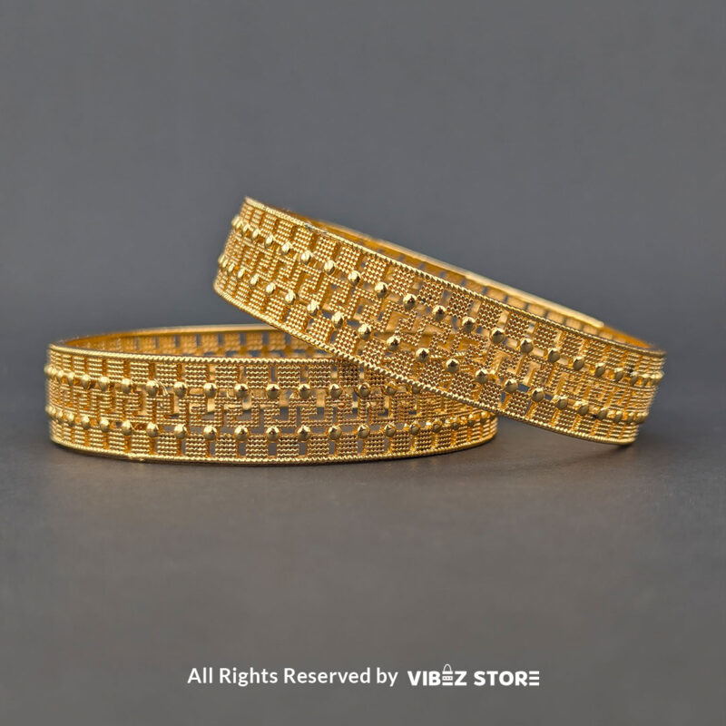 Artificial gold bangle with textured design, displayed elegantly by Vibez Store