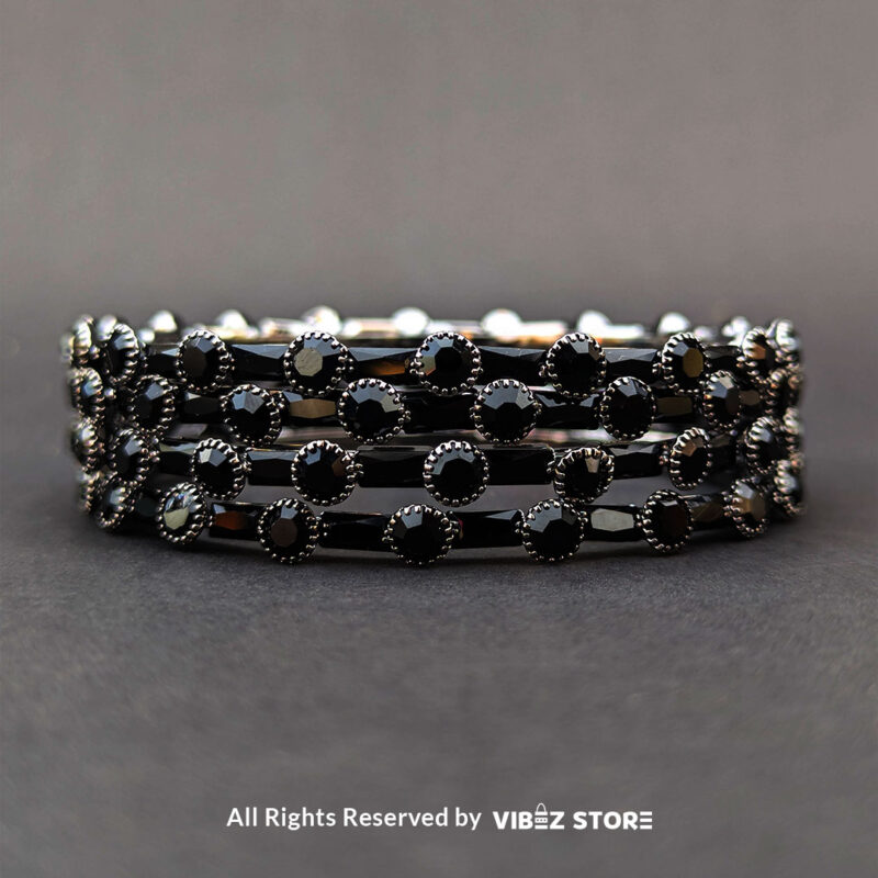 Black stone bangle with circular stone pattern, displayed elegantly by Vibez Store