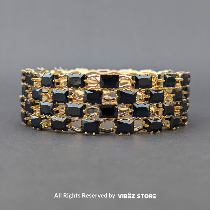 Black stone bangle with gold grid design, displayed elegantly by Vibez Store.