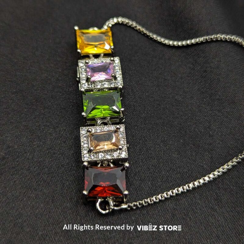 Silver-tone adjustable bracelet with vibrant multi-colored rectangular stones