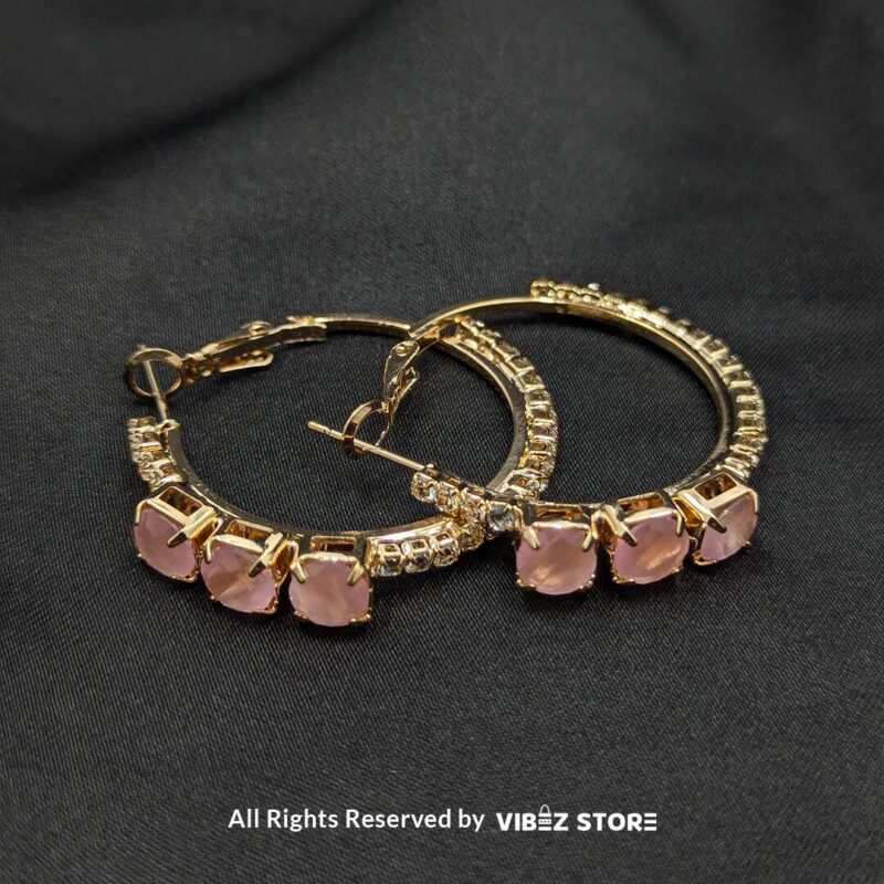 Gold-plated hoop earrings with pink stones and crystal accents, perfect for formal and casual occasions.