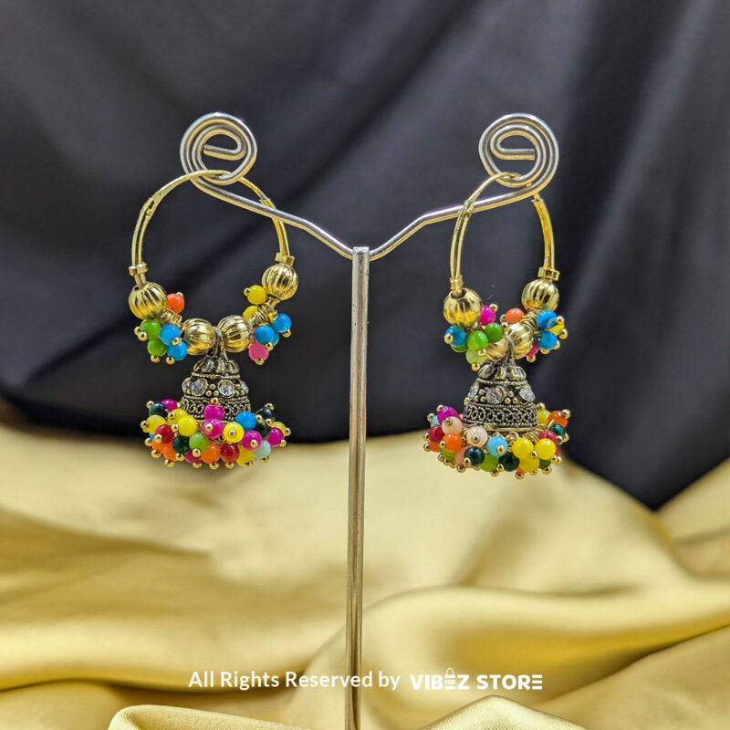 Gold-tone jhumka earrings with vibrant multicolor beads, ideal for festive and wedding occasions.