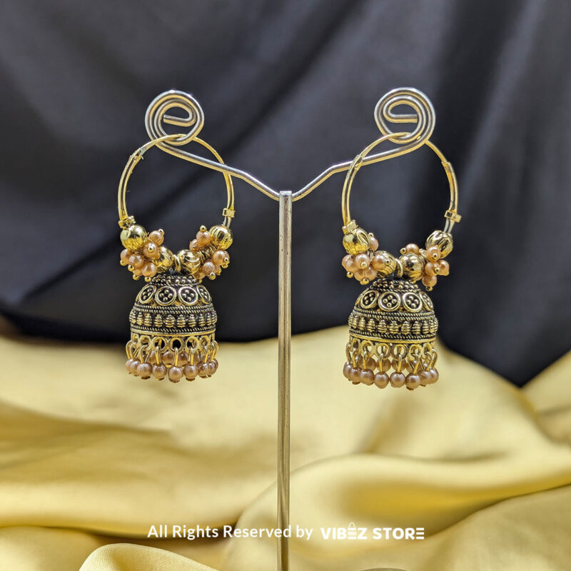 Golden hoop jhumka earrings with pearl drops and intricate beaded detailing, perfect for ethnic wear.