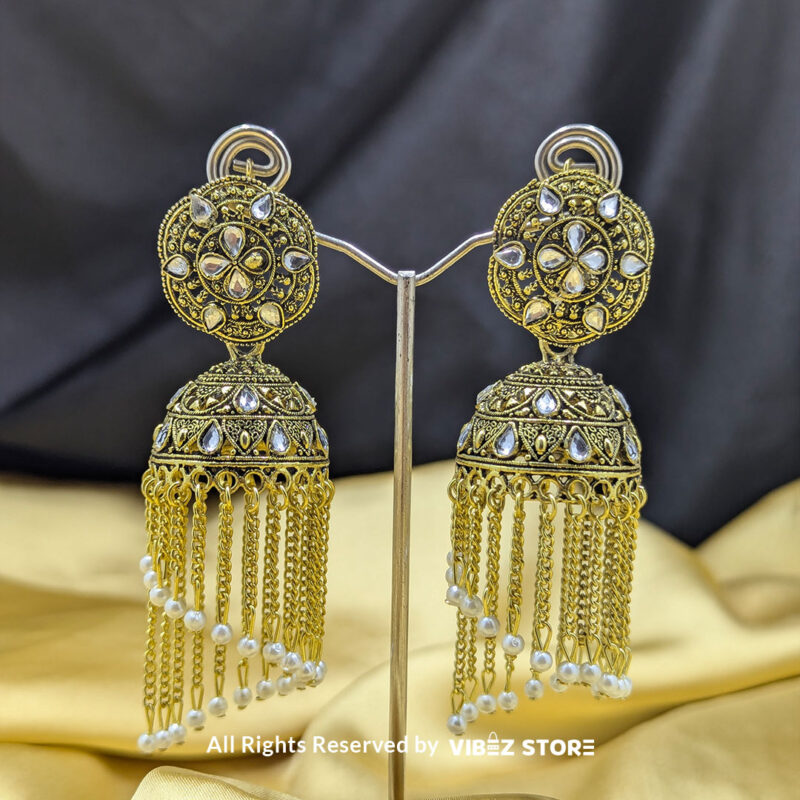 Golden chandbali jhumka earrings with pearl embellishments and cascading chain danglers, perfect for ethnic wear.