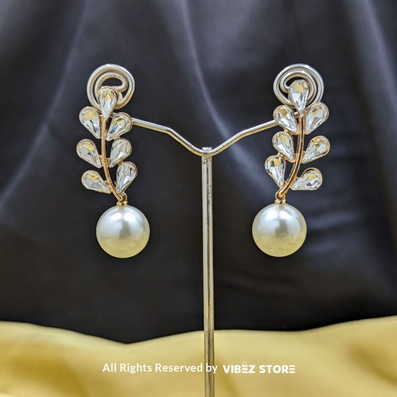 Leaf Pearl Drop Earrings with gold-tone settings, delicate leaf design, and smooth pearl drops from VibezStore