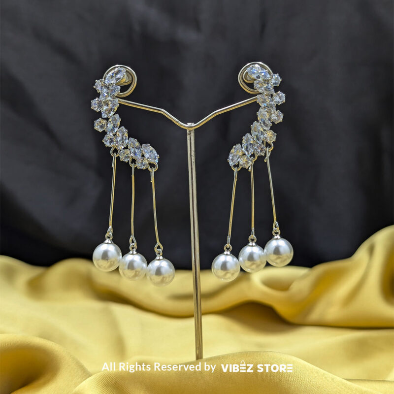 Elegant Pearl Drop Earrings 2 Close-up of Elegant Pearl Drop Earrings with shimmering crystals and dangling pearls.