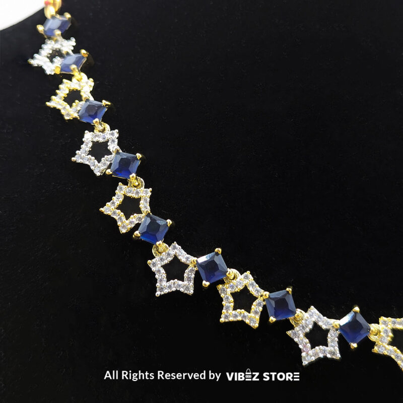 Midnight Sapphire Star Necklace and Earring Set with gold-tone star designs, faux sapphire stones, and crystal accents from VibezStore