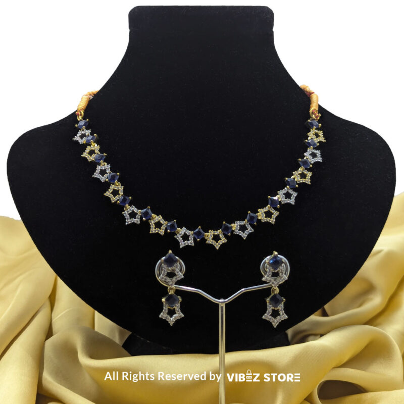 Midnight Sapphire Star Necklace and Earring Set with gold-tone star designs, faux sapphire stones, and crystal accents from VibezStore