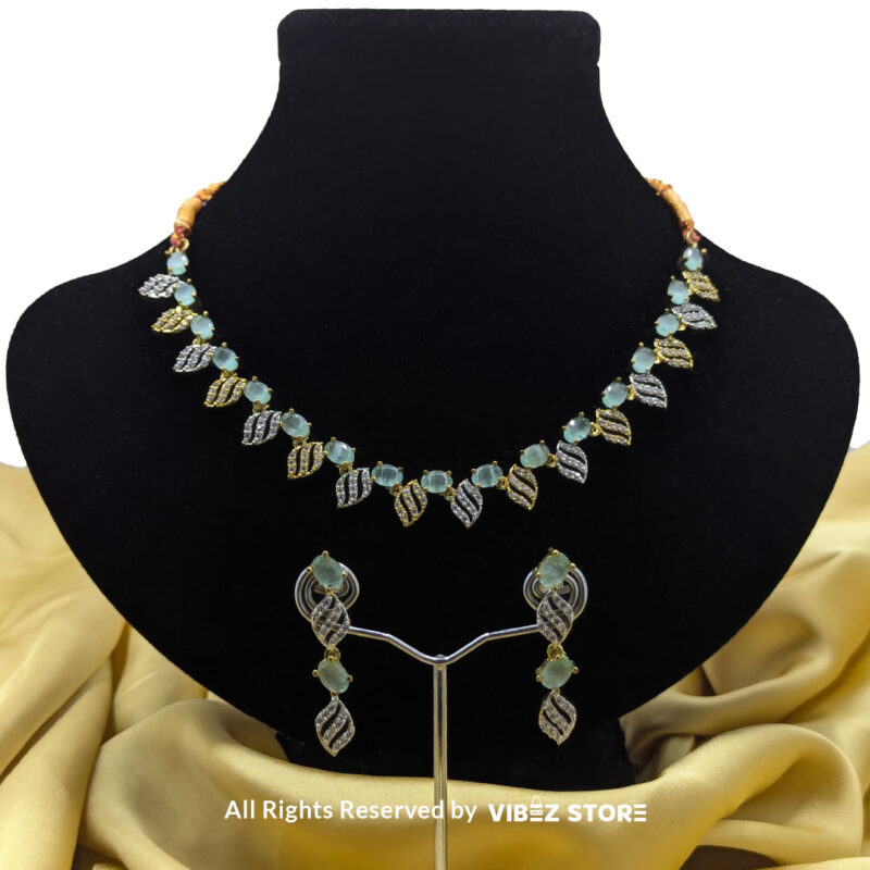 Mint Green Leaf Necklace and Earring Set with gold-tone settings, mint green gemstones, and leaf-shaped crystal designs from VibezStore