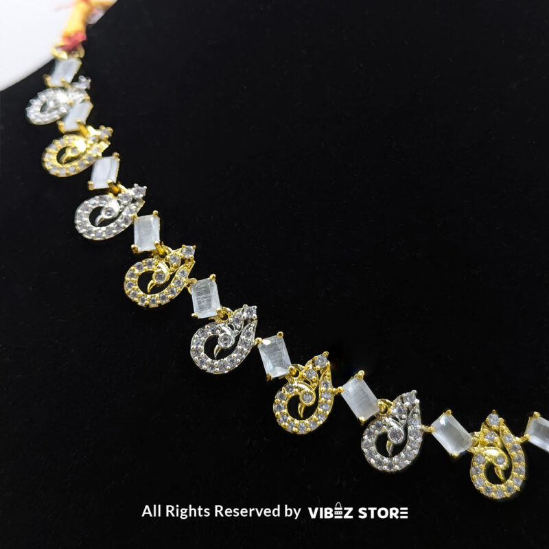 Crystal Swirl Necklace and Earring Set with gold-tone accents and crystal swirl designs from VibezStore