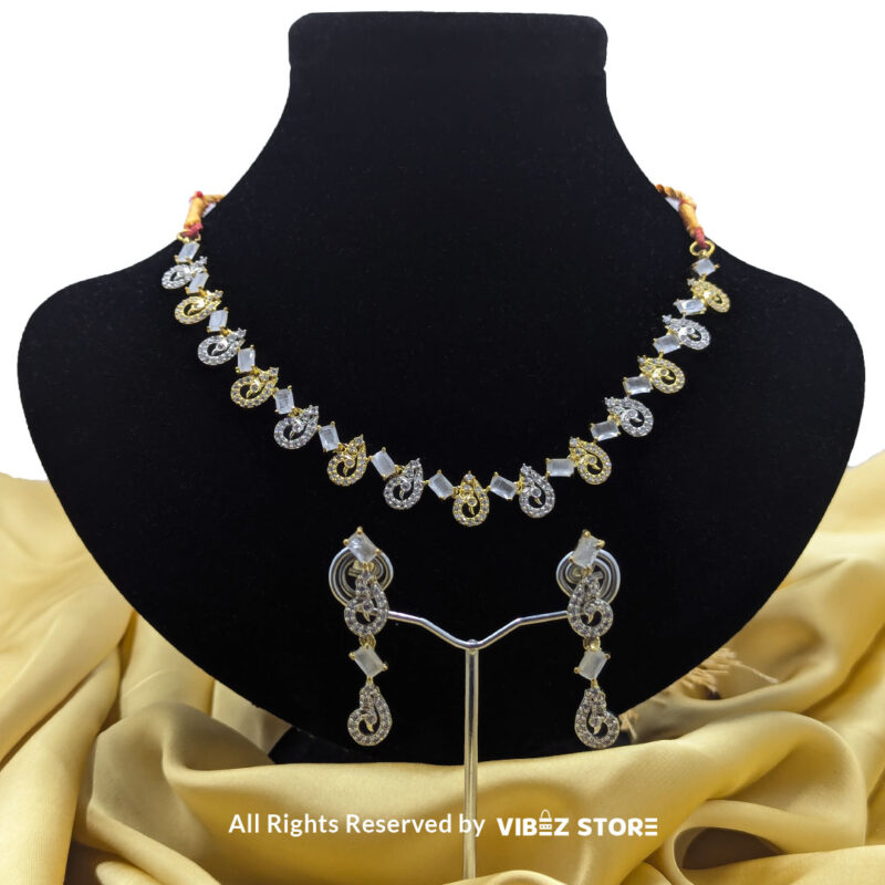 Crystal Swirl Necklace and Earring Set with gold-tone accents and crystal swirl designs from VibezStore