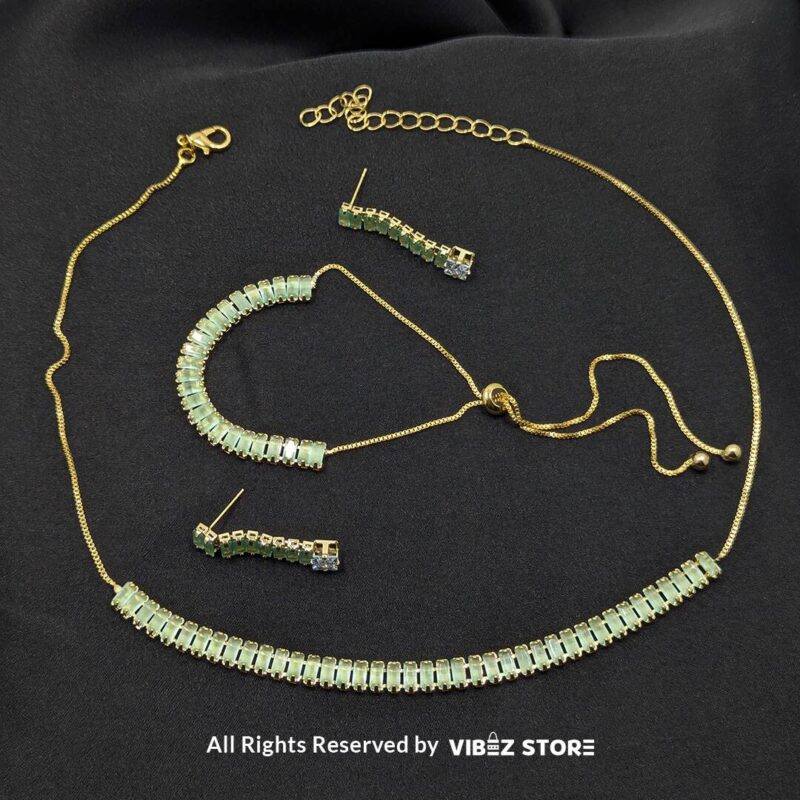 Mint green crystal jewelry set with a necklace, bracelet, ring, and earrings featuring baguette-style crystals.