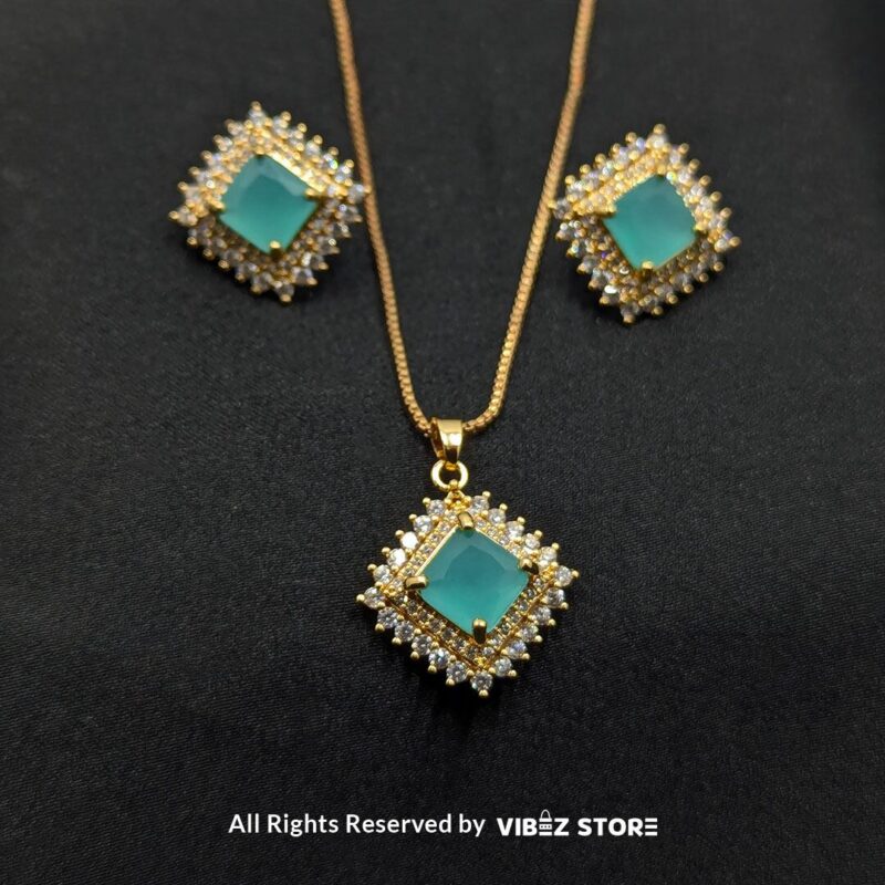 Aqua blue square pendant jewelry set featuring a soft blue gemstone necklace with matching stud earrings, surrounded by sparkling stones.