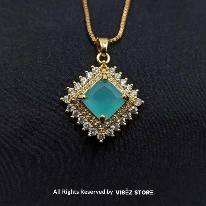 Aqua blue square pendant jewelry set featuring a soft blue gemstone necklace with matching stud earrings, surrounded by sparkling stones.