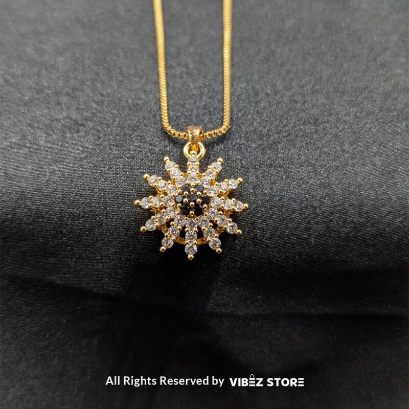 Radiant sunflower-inspired pendant and matching earrings set, crafted with sparkling crystals on a sleek black backdrop.