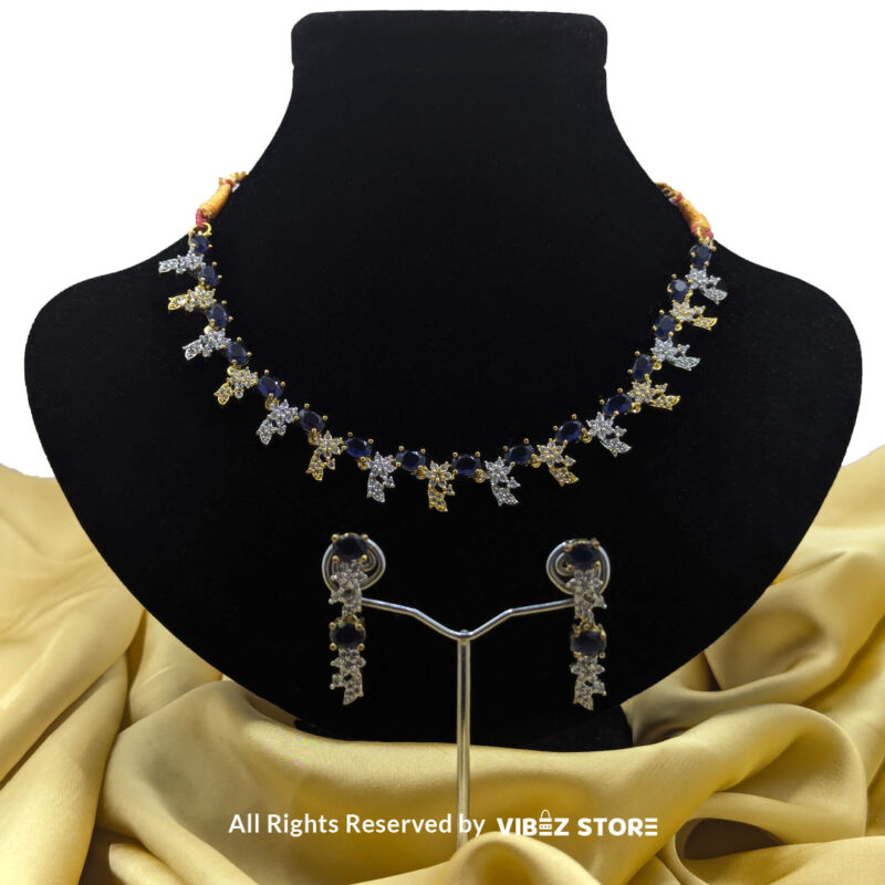 Sapphire Floral Necklace and Earring Set with gold-tone settings, faux sapphire stones, and crystal floral designs from VibezStore