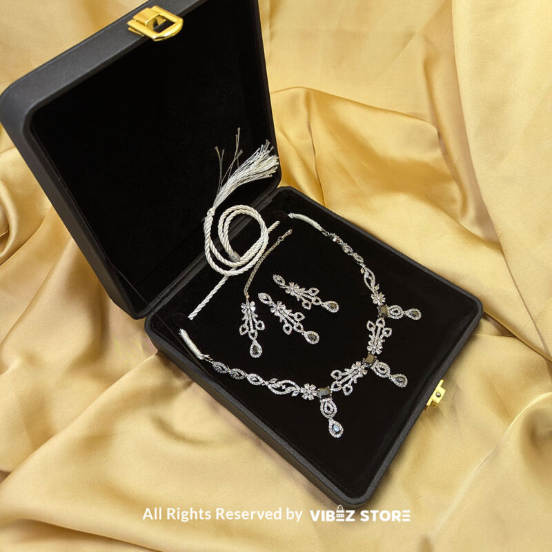 Elegant Crystal Bridal Necklace Set Silver-Tone with Earrings & Maang Tikka 4 Elegant Crystal Bridal Necklace Set with silver-tone settings, matching earrings, and maang tikka from VibezStore