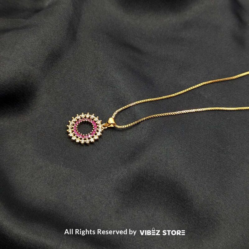 Three round cluster crystal lockets in gold, silver, and silver-pink designs displayed elegantly on a black fabric background.