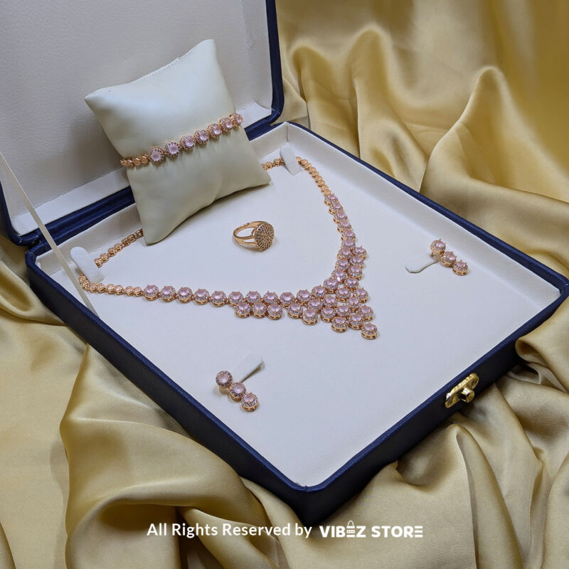 Elegant Rose Quartz Jewelry Set 2 Gold-tone jewelry set with rose quartz-inspired stones, including a necklace, earrings, bracelet, and ring, elegantly displayed by Vibez Store.
