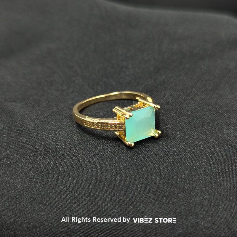 Gold-tone non-adjustable rings with square gemstones in multiple colors, including rose pink, aqua blue, emerald green, ruby red, black, crystal white, and amber gold, beautifully displayed by Vibez Store.