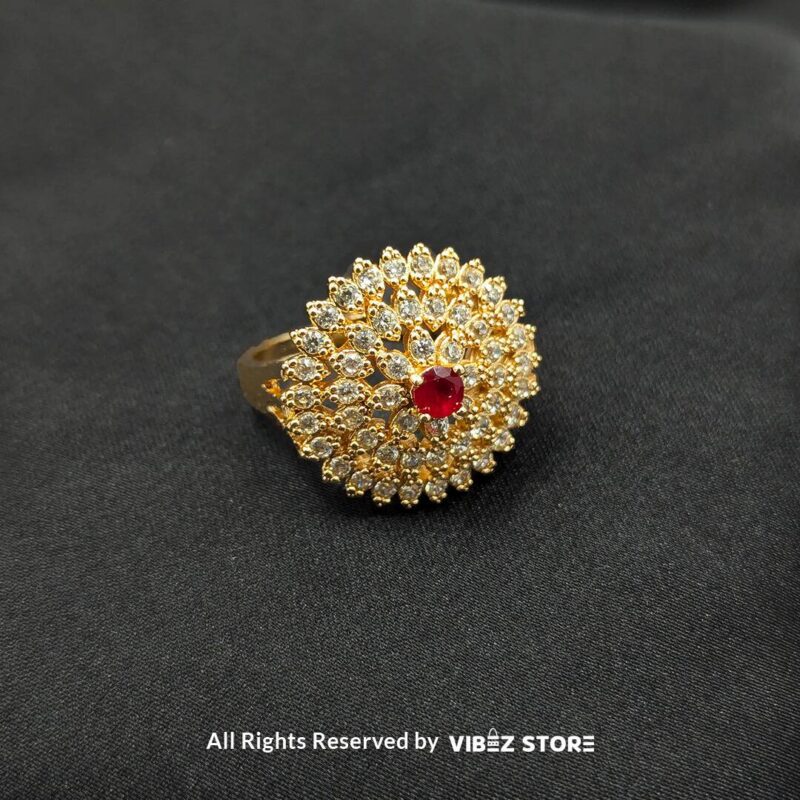 Gold-tone floral rings with crystal accents and central gemstones in jet black, ruby red, and champagne gold, beautifully displayed by Vibez Store.