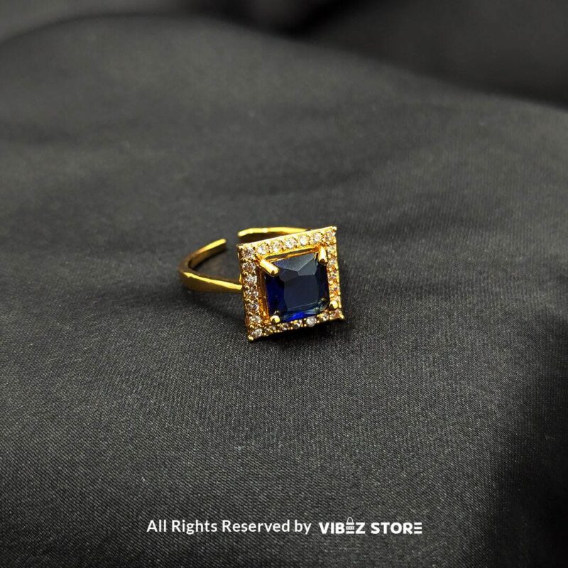 Gold-tone adjustable rings with square gemstones in rose pink, aqua blue, and sapphire variations, elegantly displayed by Vibez Store.