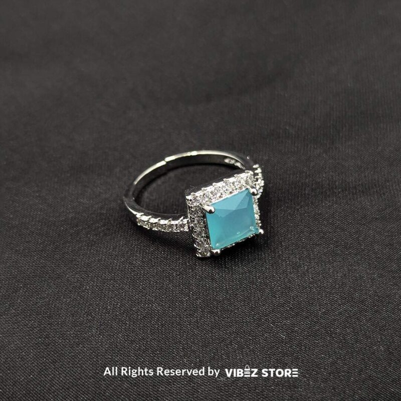 Silver-tone adjustable rings with square gemstones in aqua blue, rose pink, and emerald green, elegantly displayed by Vibez Store.