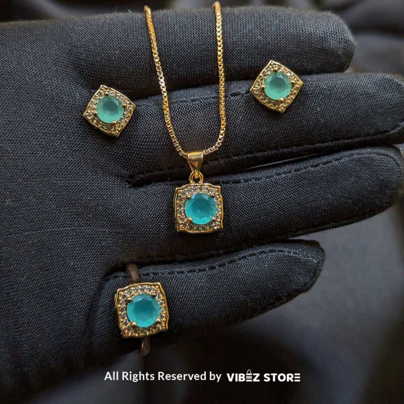 Aqua Radiance Jewelry Set – Necklace, Earrings, and Ring 2 Aqua Radiance Jewelry Set featuring an aqua gemstone necklace, earrings, and ring with crystal accents and a gold-tone finish – Vibez Store.